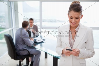 Marketing manager reading text message