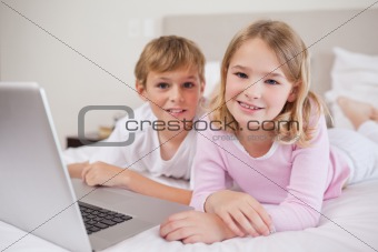 Cute children using a notebook