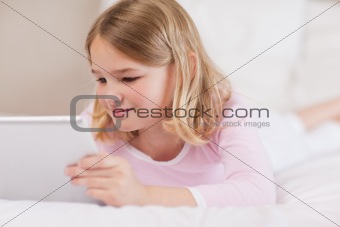 Cute girl using a tablet computer