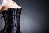 Close-up shot of woman in black corset 