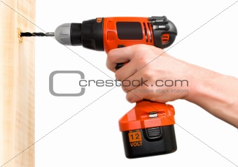Man's hand holding drill