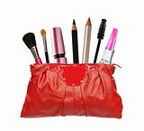 Beautiful red makeup bag and cosmetics isolated on white