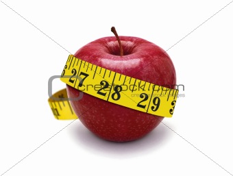 red apple and measurement tape