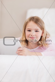 Portrait of a cute little girl using a tablet computer