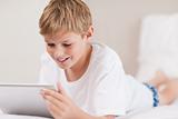 Smiling boy using a tablet computer