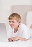 Portrait of a cute boy using a laptop