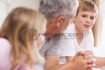 Father having a discussion with his children
