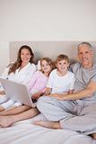 Portrait of a family using a laptop