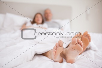 Couple lying in a bed