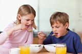 Young children having breakfast