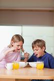 Portrait of children having breakfast