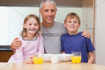 Father posing with his children in the morning