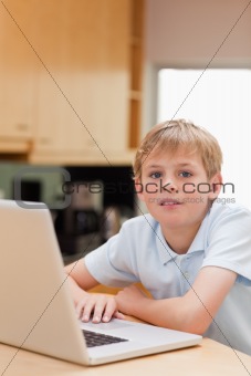 Portrait of a boy using a notebook