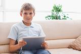Happy boy using tablet computer