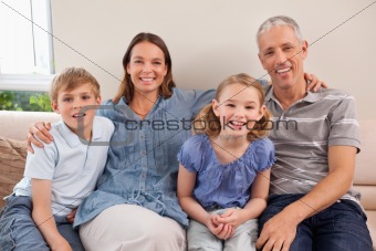 Family sitting on a sofa