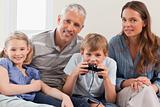 Charming family playing video games