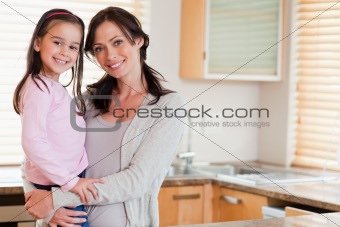 Girl and her mother posing
