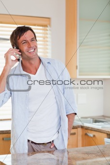 Portrait of a smiling man making a phone call
