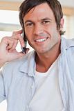 Portrait of an attractive man making a phone call