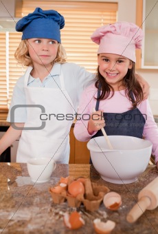 Portrait of siblings baking together