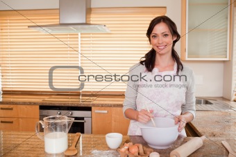 Smiling woman baking