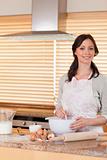 Portrait of a beautiful woman baking