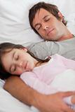 Portrait of a calm father sleeping with his daughter