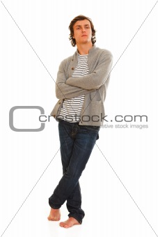 Full length portrait of young man posing on white background
