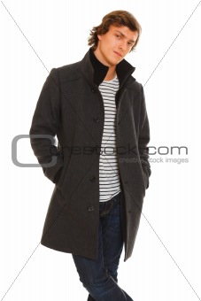 Portrait of thoughtful guy in winter coat
