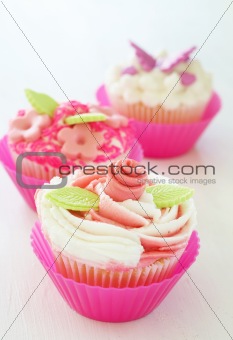 Vanilla cupcakes with various decorations