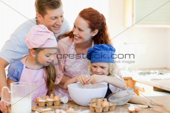 Happy family enjoys baking together