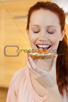 Woman eating a slice of bread