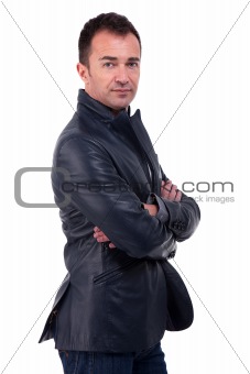 Portrait of a handsome  man, with arms crossed, on white background. Studio shot