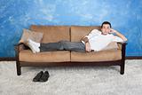 Man Relaxes on Sofa