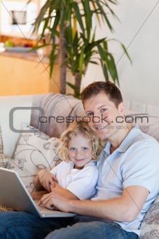 Father and son together with laptop