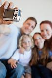 Digi cam being used to take family picture