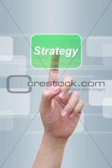 hand pushing strategy button on a touch screen interface