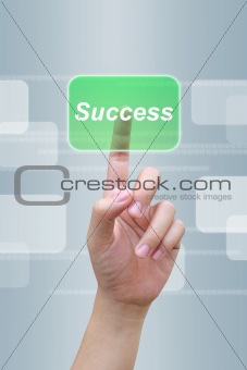 hand pushing success button on a touch screen interface