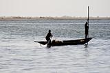 Fishermen in a pirogue in the river Niger.