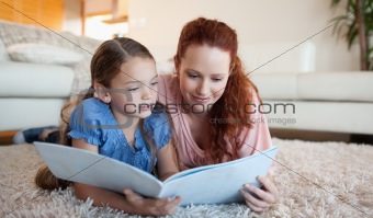 Mother and daughter looking at a magazine