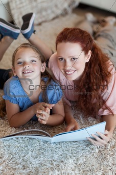 Mother and daughter on the floor reading