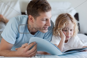 Father and son reading a magazine