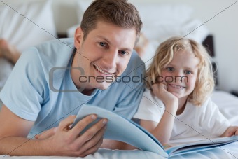 Father and son looking at magazine