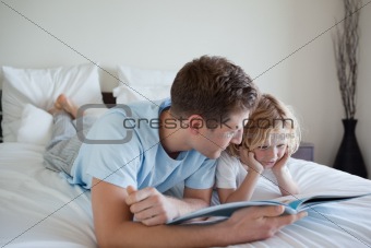 Father doing reading exercises with his son