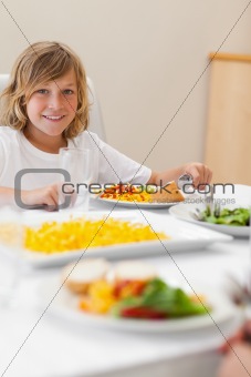 Boy sitting at dinner table