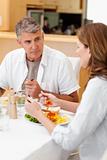 Man talking to wife during dinner