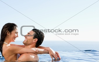 Couple embracing in the pool