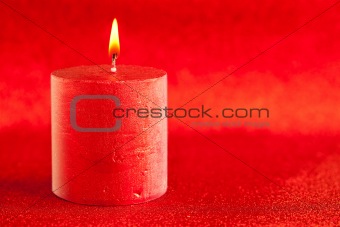 christmas candle candlelight on red glitter