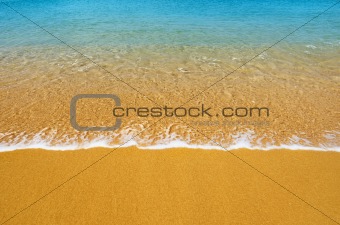 Surf on tropical beach - background