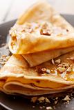 crepes with honey or syrup and roasted nuts